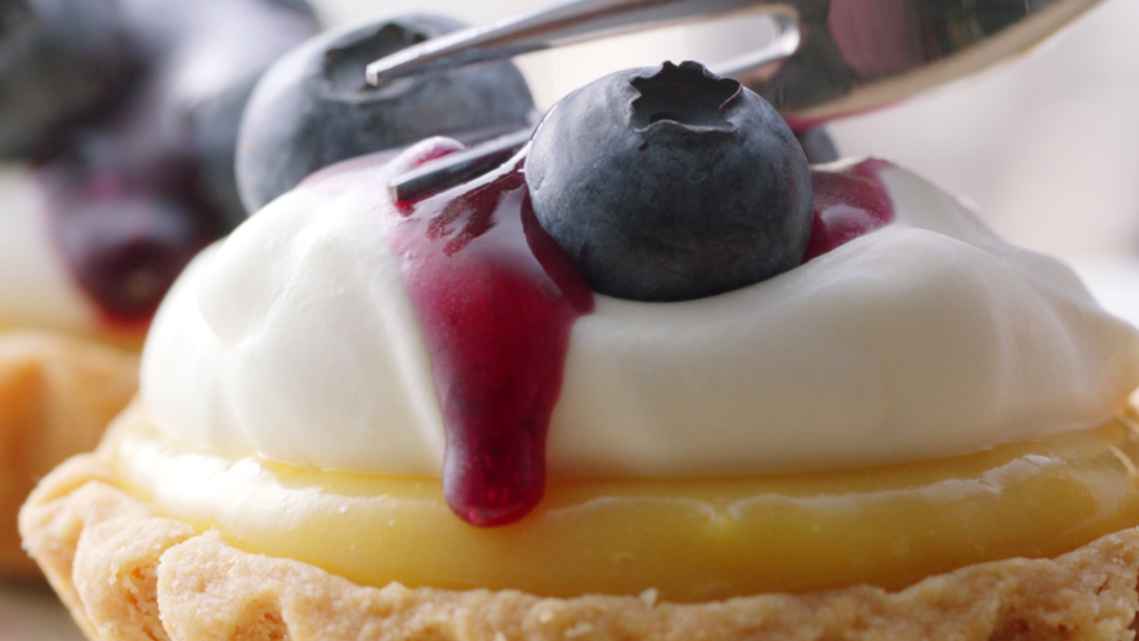 Peachy Keen Colourist Angela Cerasi colour graded this shot of a lemon tartlet covered in Bulla whipped cream, blueberries and blueberry sauce, for the brand campaign for Bulla "Craft"