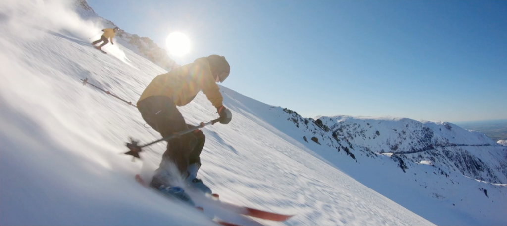 The Peachy's Team of colourists colour graded this shot of a skier, highlighted by a sunflare as they make their way down the snowy mountain, for the observational documentary TV series "Mt Hutt Rescue"