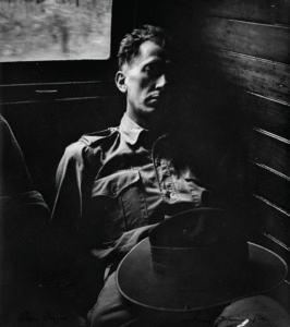 Black and white photograph by Australian photographer Max Dupain: "The dozing soldier" from 1943