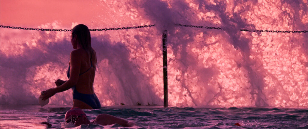 Image of waves spraying over a swimming pool, graded by Angela Cerasi